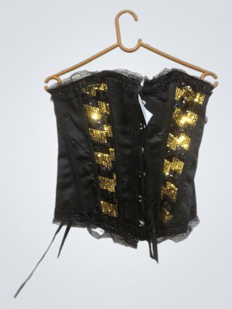 Schwarzes Korsett mit goldenen Pailletten und Spitzenbesatz