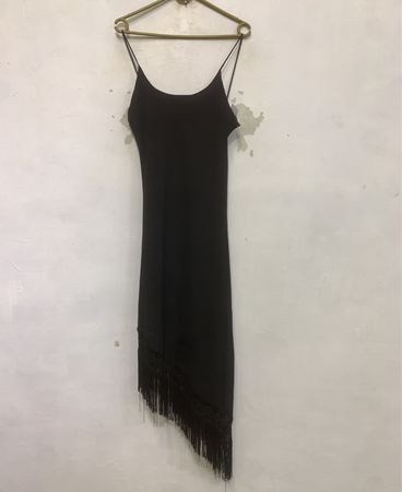 Black slip dress with fringe hem