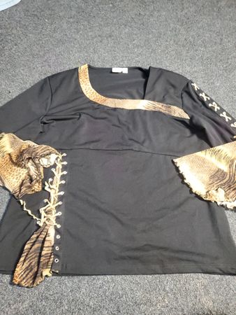 Black long sleeve top with snake print trim and lace-up detail