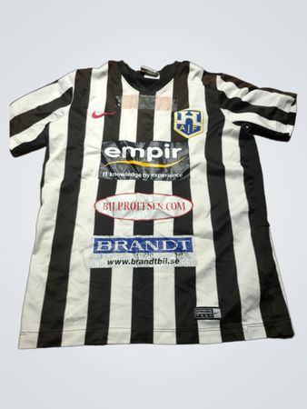 Black and White Striped Soccer Jersey with Logos and Number 15