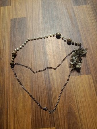 Beaded necklace with chain and floral accent