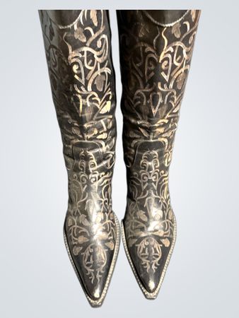 Black cowboy boots with ornate silver detailing