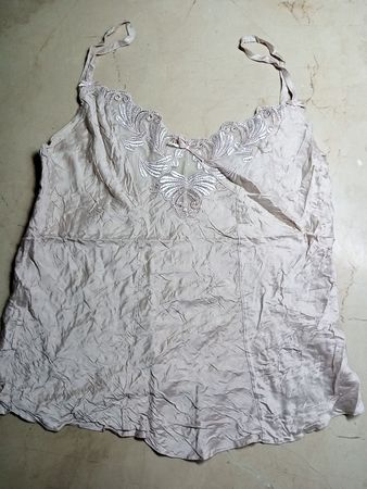 Blush-colored camisole with lace details
