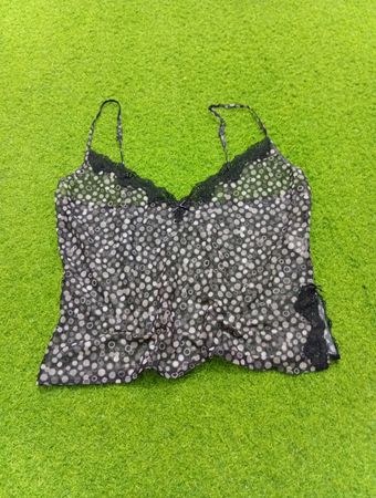Sheer polka dot camisole with lace trim