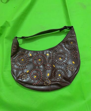 Brown hobo bag with embroidered swirls