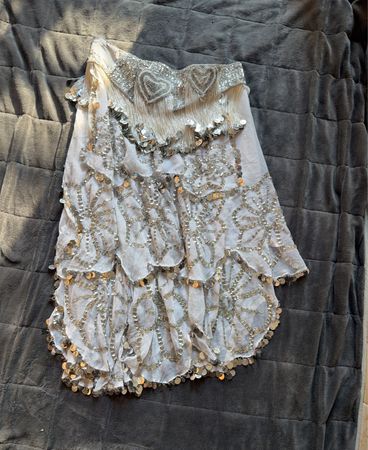 White skirt with sequin and fringe embellishments