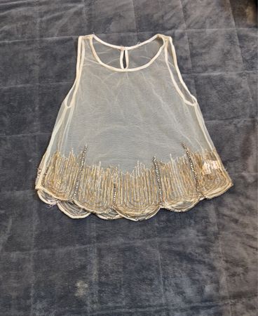 Débardeur transparent orné de perles