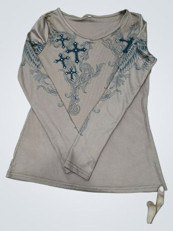 Brown long-sleeved shirt with cross and wing design