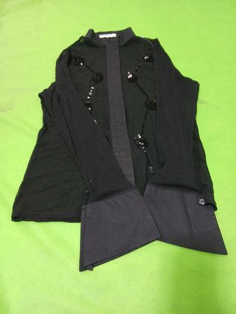 Black sheer top with sequins and wide cuffs