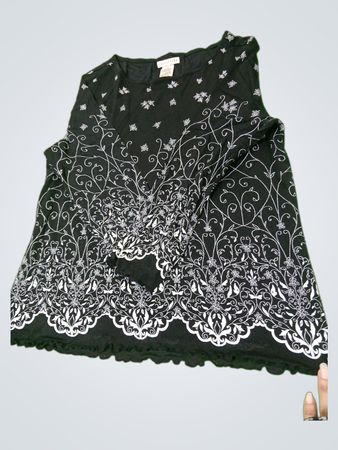 Apostrophe schwarzes Oberteil mit weißem Blumenmuster