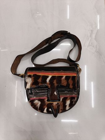 Brown leather crossbody bag with fur accents