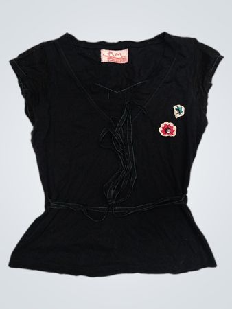 Schwarzes Peplum-Oberteil mit Blumenapplikationen