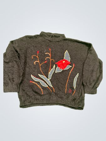 Schwarzer Strickpullover mit floralem Applikation