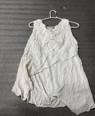 White Sleeveless Garment