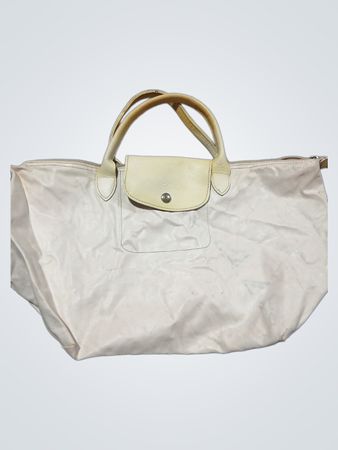 White handbag with beige leather accents