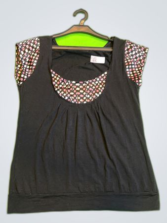 Black Sleeveless Top with Polka Dot Accents