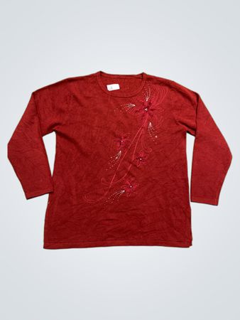 Pull rouge à manches longues avec des embellissements floraux
