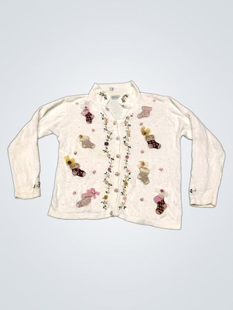 Weißer Pullover mit gestickten Strümpfen und Blumen
