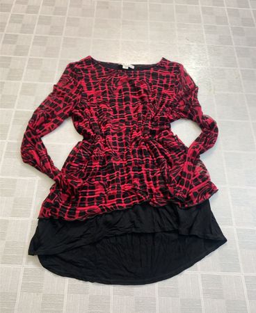 Red and black printed top with black skirt