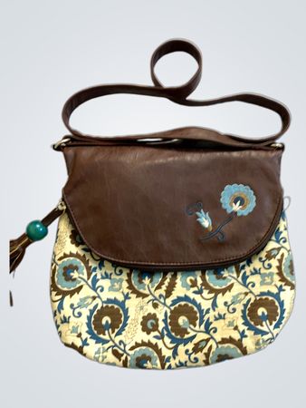 Brown and patterned crossbody bag with tassel