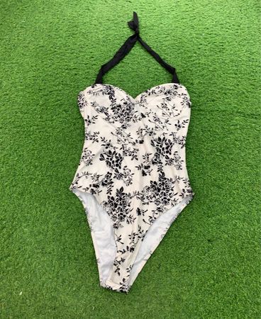 White floral print one-piece swimsuit with black halter neck