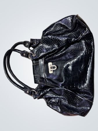 Schwarze geprägte Handtasche