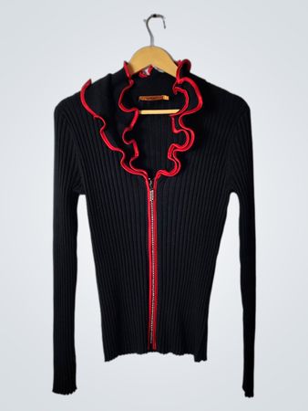 belldion black knit top with red ruffles