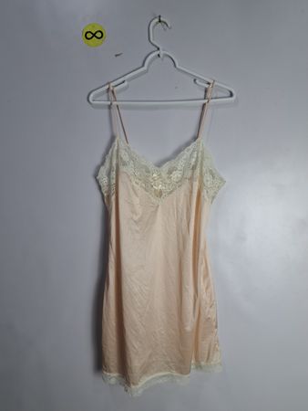 Peach-colored camisole with lace trim