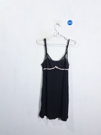 Black camisole with lace trim and pink ribbon detail