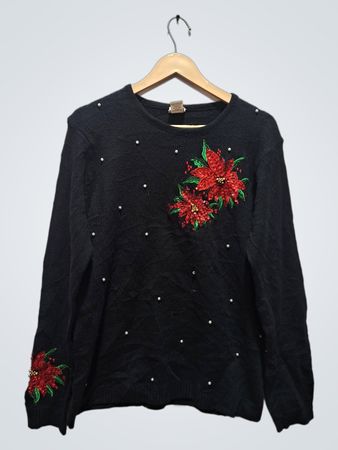 Adrian Delsfield schwarzer Pullover mit Weihnachtsstern-Verzierung