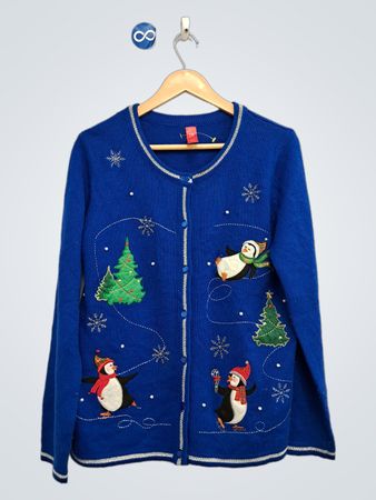 Blauer Weihnachtsstrickjacke mit Pinguinen und Tannenbäumen