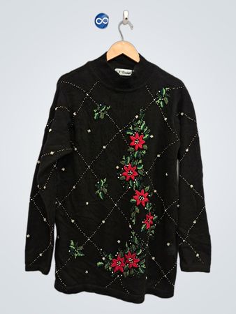 Schwarzer Weihnachtspullover mit Weihnachtsstern- und Perlenverzierungen