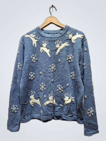 Blauer Weihnachtspullover mit Rentieren und Schneeflocken