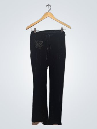 Pantaloni in velluto nero con decorazioni