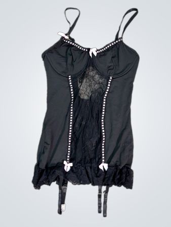 Black babydoll lingerie with pink bows and garters
