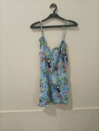 Blauer Overall mit Tukan- und Blumenmuster