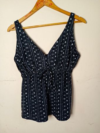 Black and white patterned tank top with tie waist