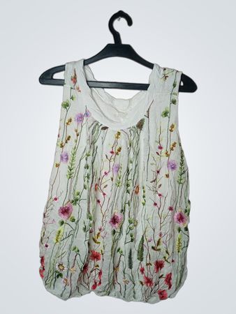 Weißes ärmelloses Top mit floraler Stickerei