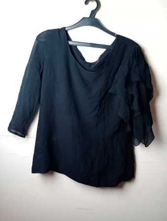 Schwarze transparente Rüschbluse