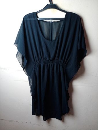 Schwarzes durchscheinendes Kaftankleid
