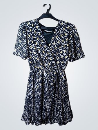 Flamant Rose schwarzes und goldfarbenes Kleid mit Rüschen und Muster