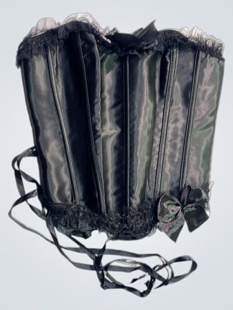 Schwarzes Korsett mit Spitzenbesatz und Bändern