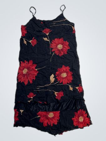 Black dress with red floral print and ruffled hem