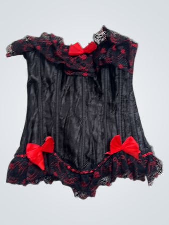 Schwarzes Korsett mit roter Spitze und Schleifen