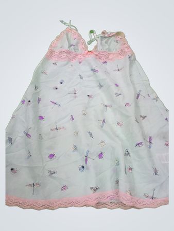 White sleeveless dress with pink lace and dragonfly print