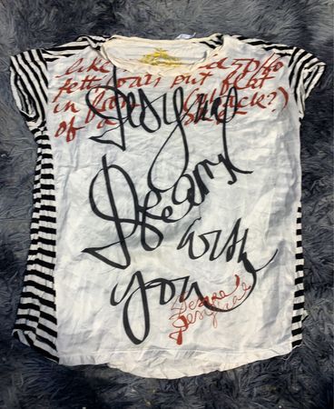 White Shirt with Black Striped Sleeves and Handwritten Text