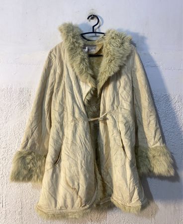 Cream colored faux fur trimmed coat