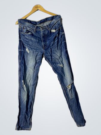 Blaue beschädigte Denim-Jeans