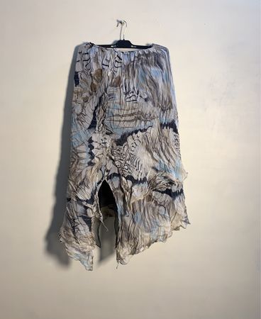 Draped asymmetric skirt with abstract print
