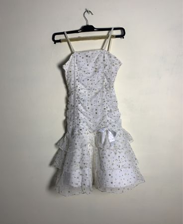White dress with gold polka dots and ruffles